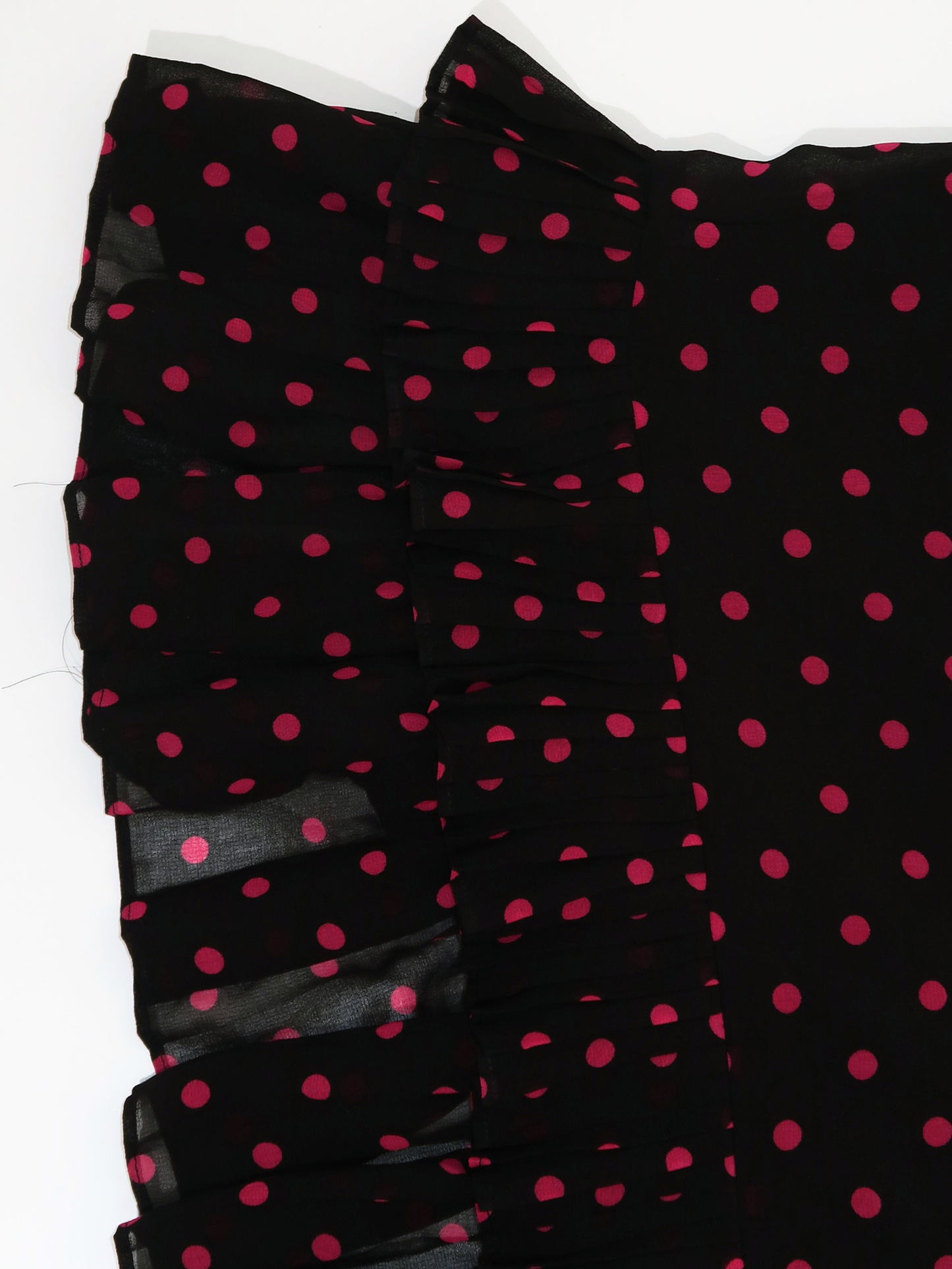 A048: “pink polka girl” | pink and black midi skirt with ruffled hem
