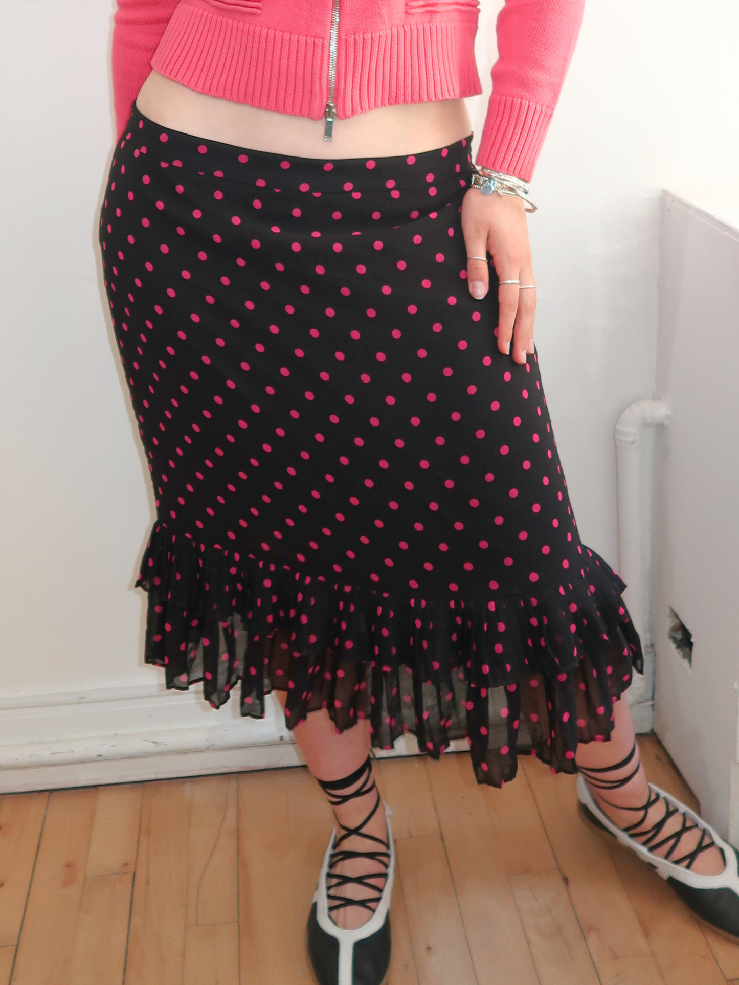 A048: “pink polka girl” | pink and black midi skirt with ruffled hem