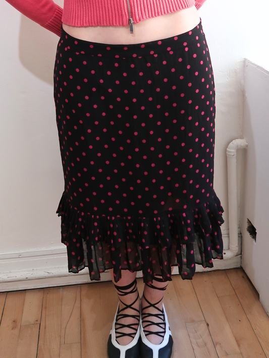 A048: “pink polka girl” | pink and black midi skirt with ruffled hem