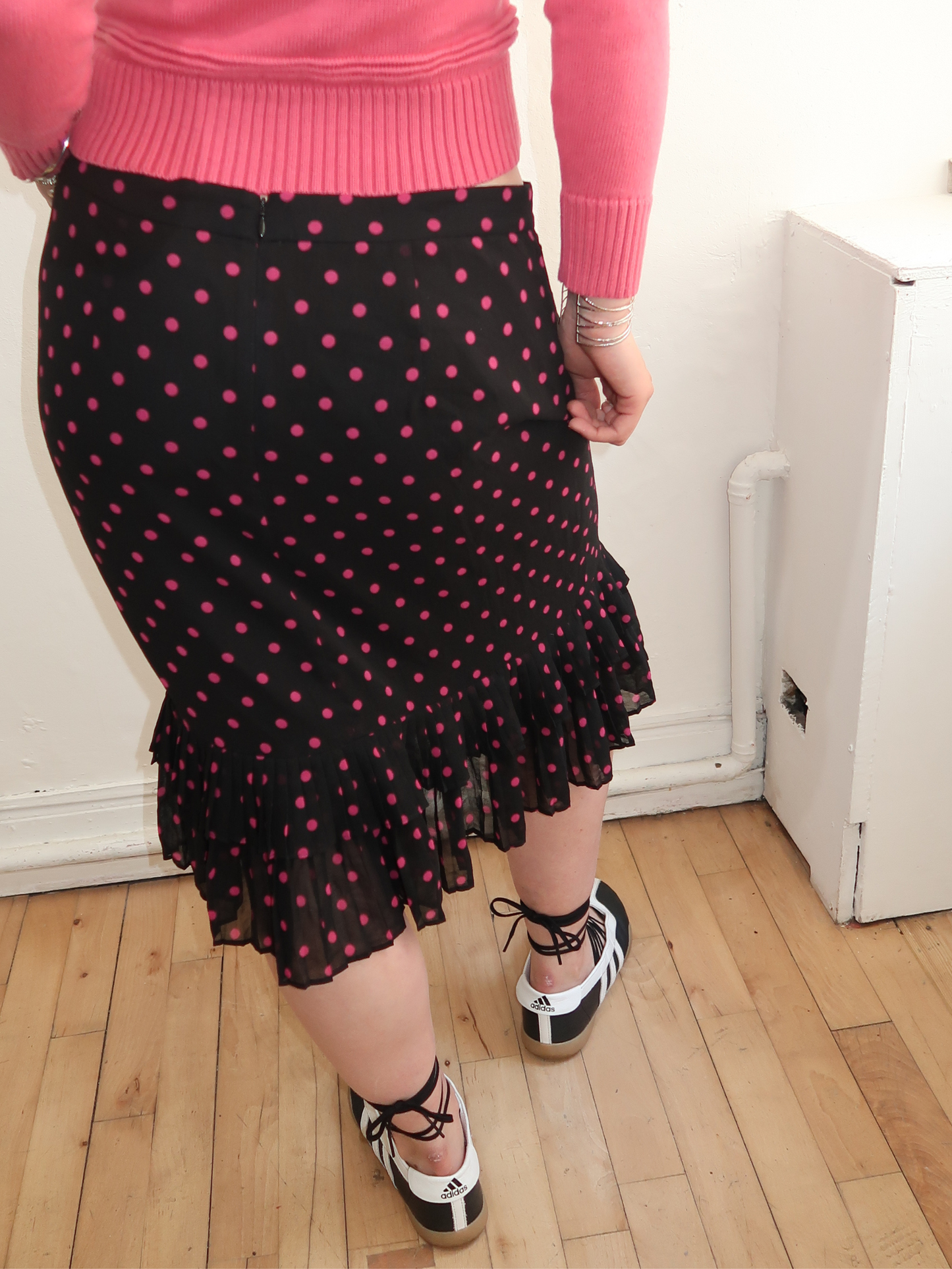 A048: “pink polka girl” | pink and black midi skirt with ruffled hem