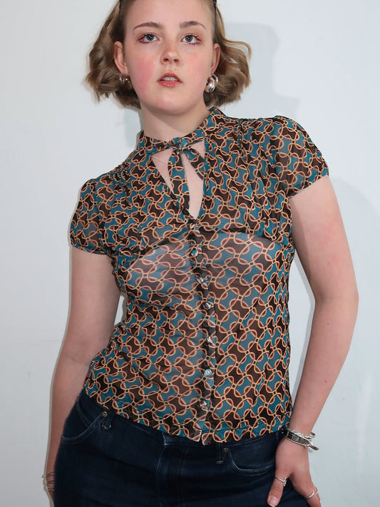A063: “70s fever” | sheer blouse with v neck
