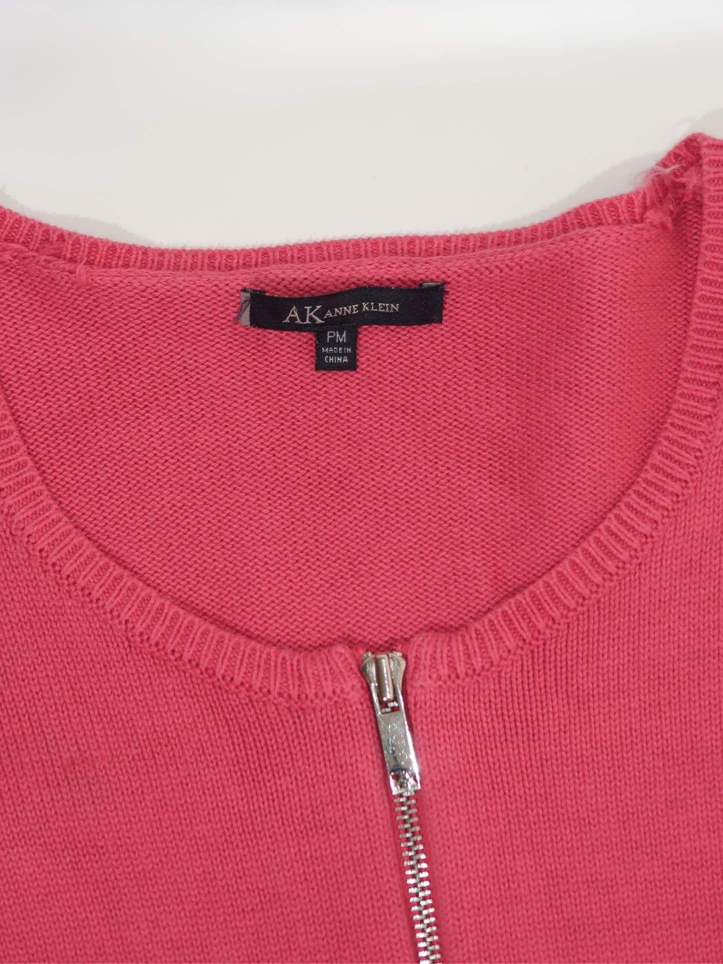 A055: “have you ever seen a pair of these bobby boucher..” | pink double zipped jumper