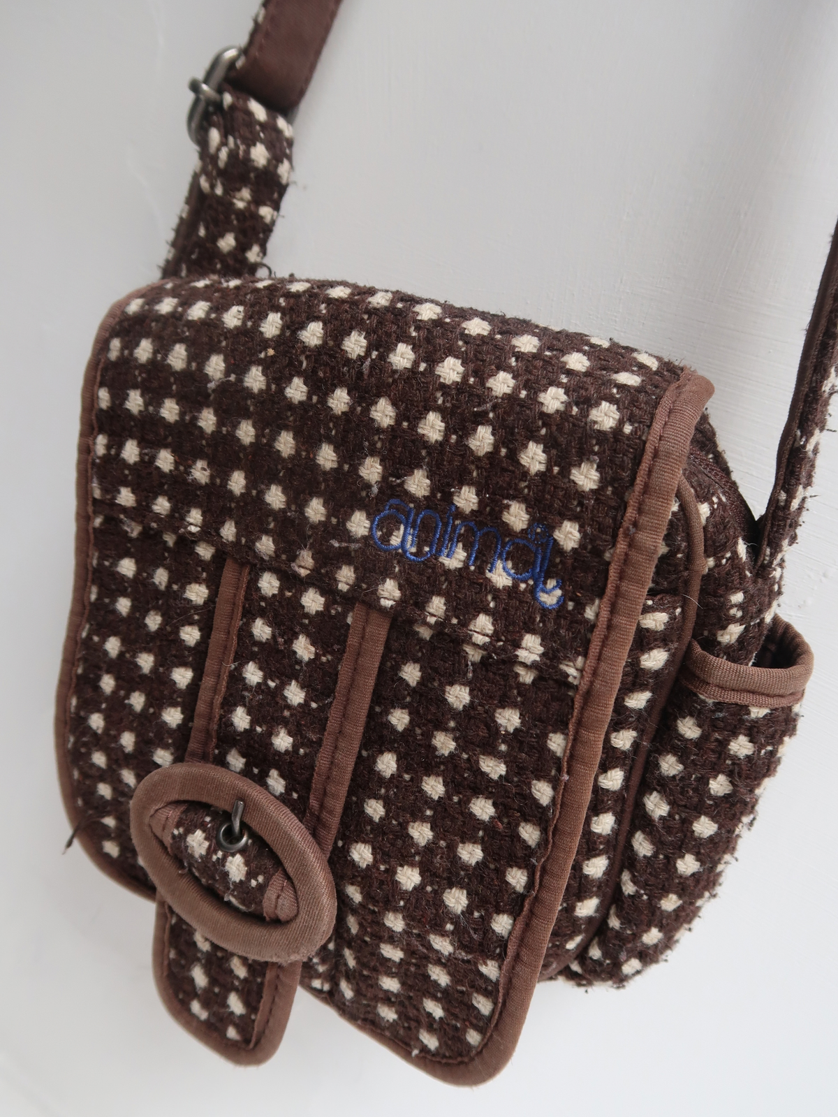 image of animal cross body bag with buckle front